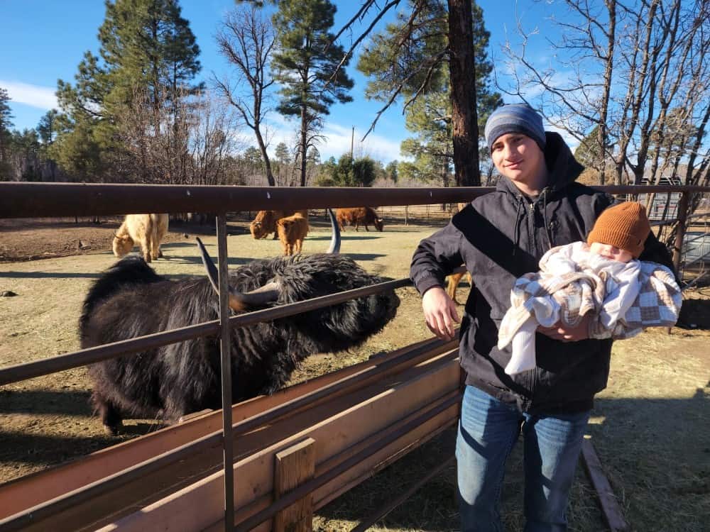 Erik with baby JJ enjoying the ranch life