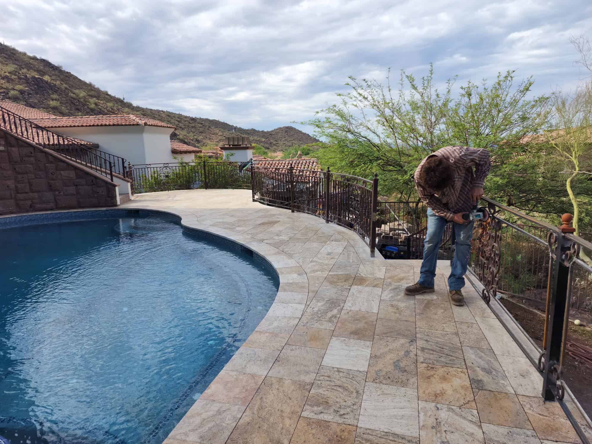 Erik Banks grinding pool fence for welding