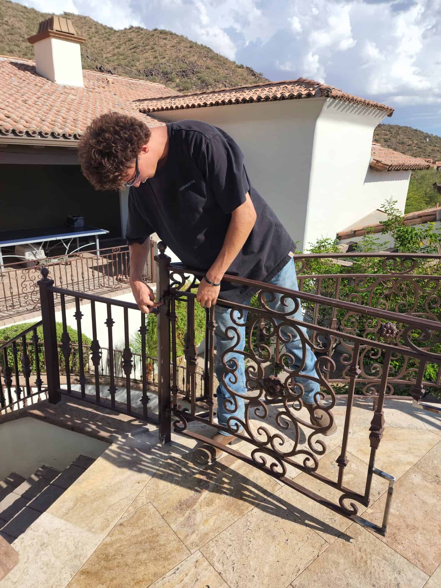 Erik Banks checking pool fence gate