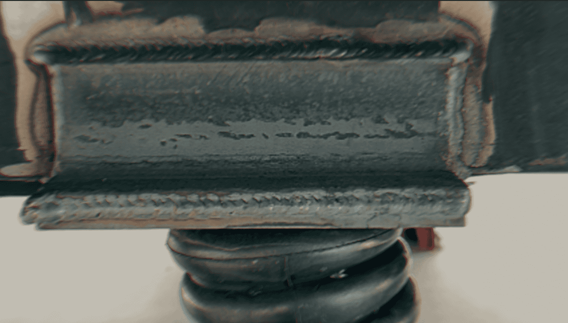 Welded steel plate reinforcement on vehicle airbag suspension mount