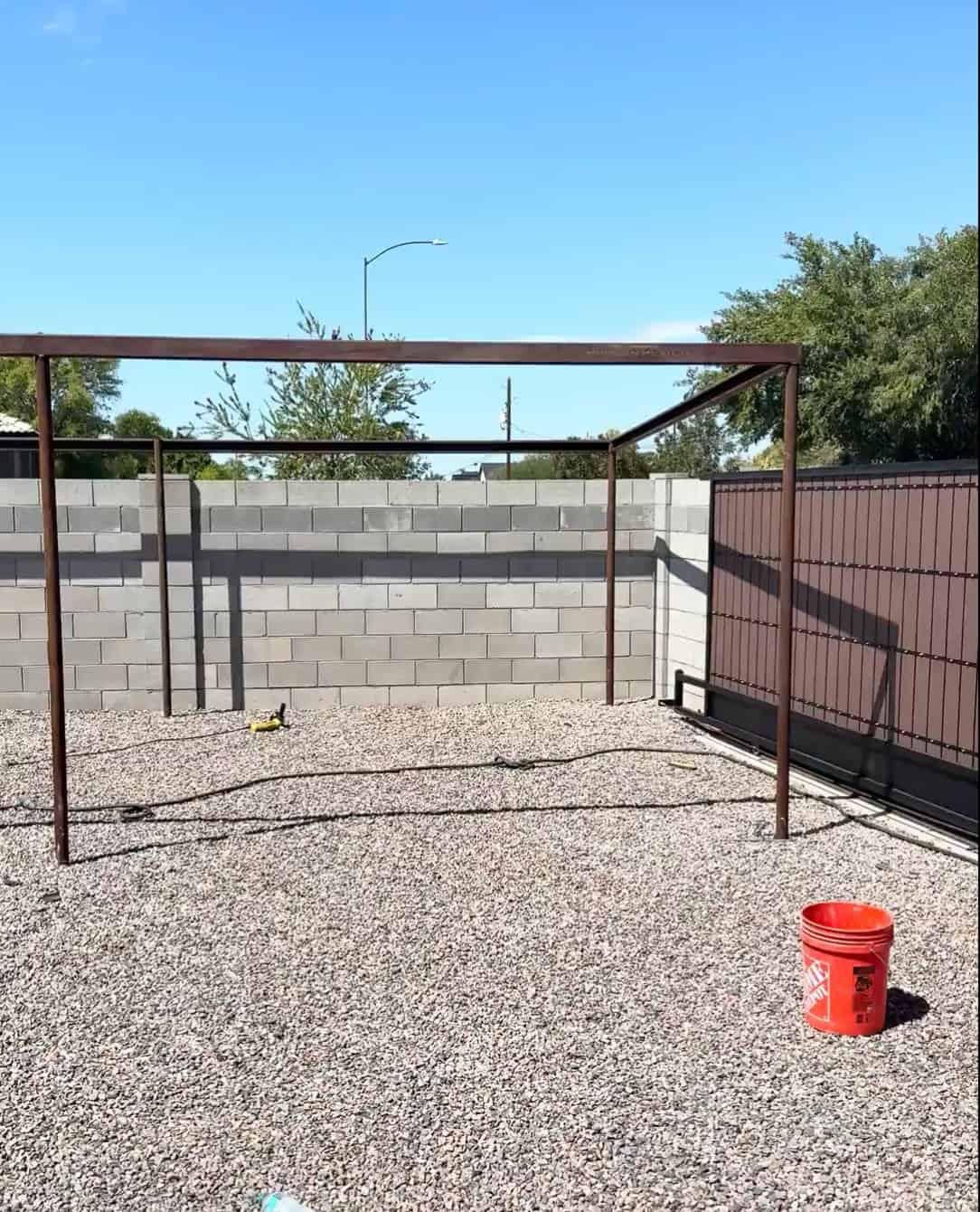 Mobile METAL Medics custom pipe shade structure with the vertical posts and perimeter upper frame assembled.